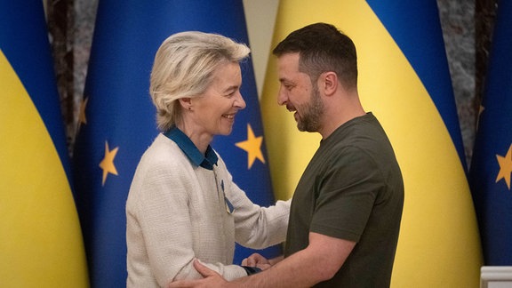 Ukrainian President Volodymyr Zelenskyy, right, and European Commission President Ursula von der Leyen greet each other in Kyiv