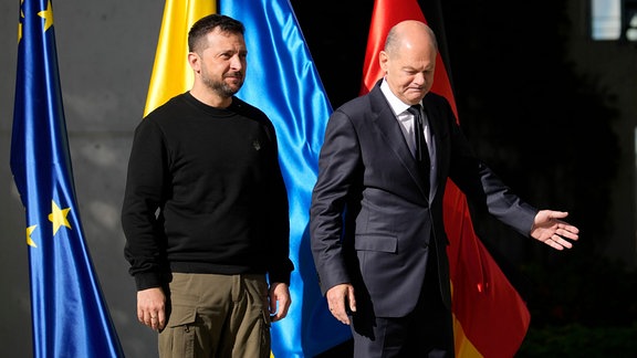 Volodymyr Zelenskyy is welcomed by German chancellor Olaf Scholz at the chancellery in Berlin.