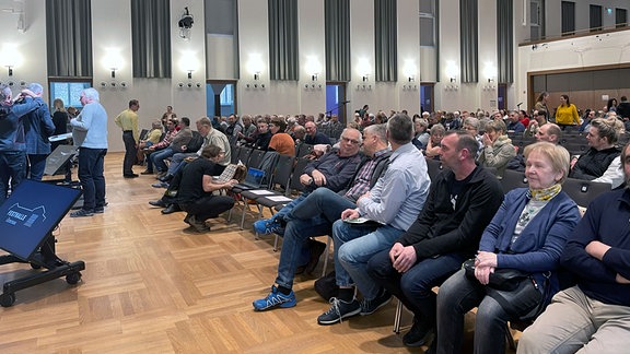 Infoveranstaltung, Besucher auf Sitzplätzen.