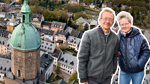 Ein Mann und eine Frau vor einer Stadtkulisse